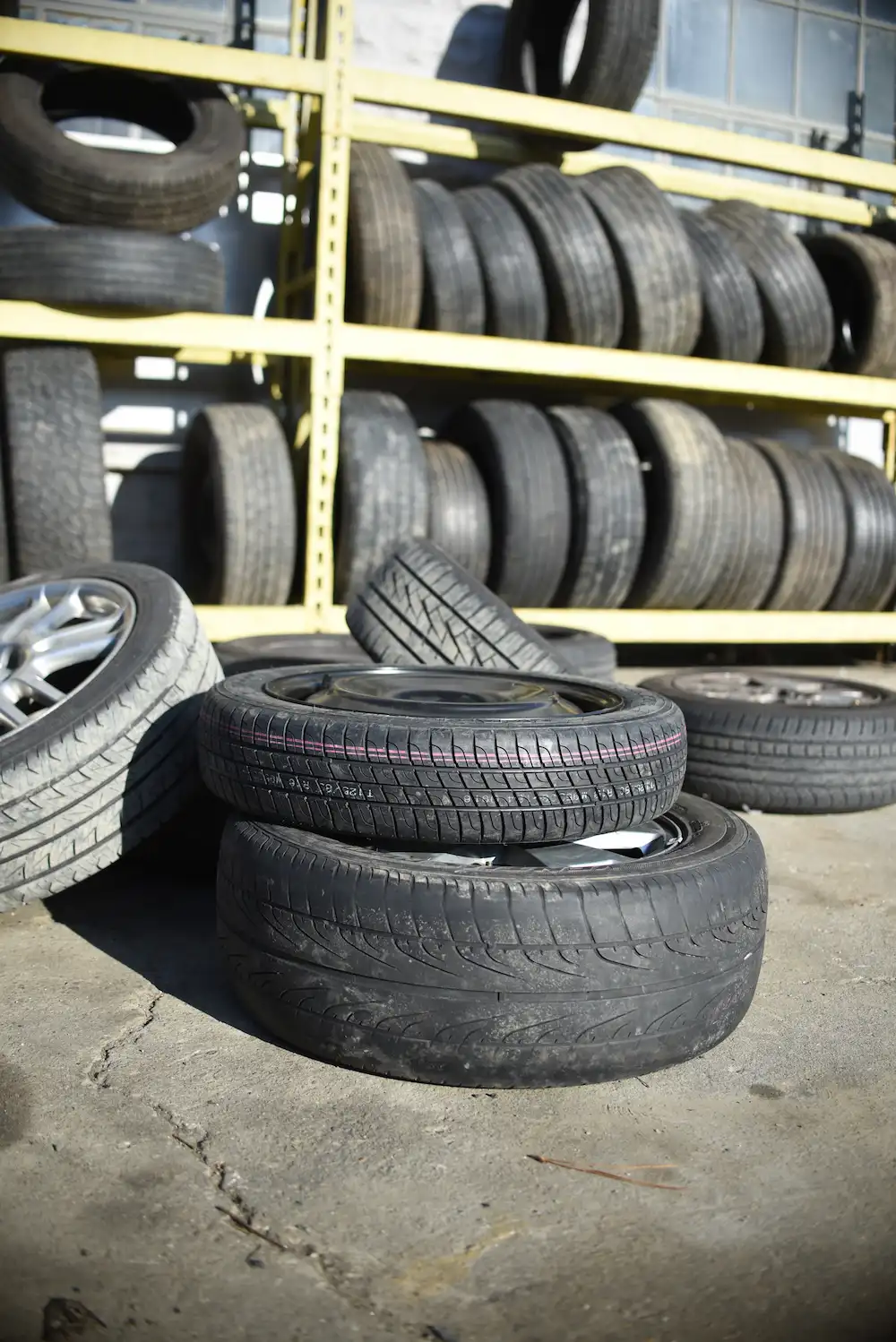 Stack of tires at a self-serve salvage yard