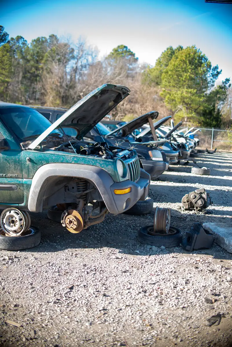 Row of vehicles at a self-serve salvage yard