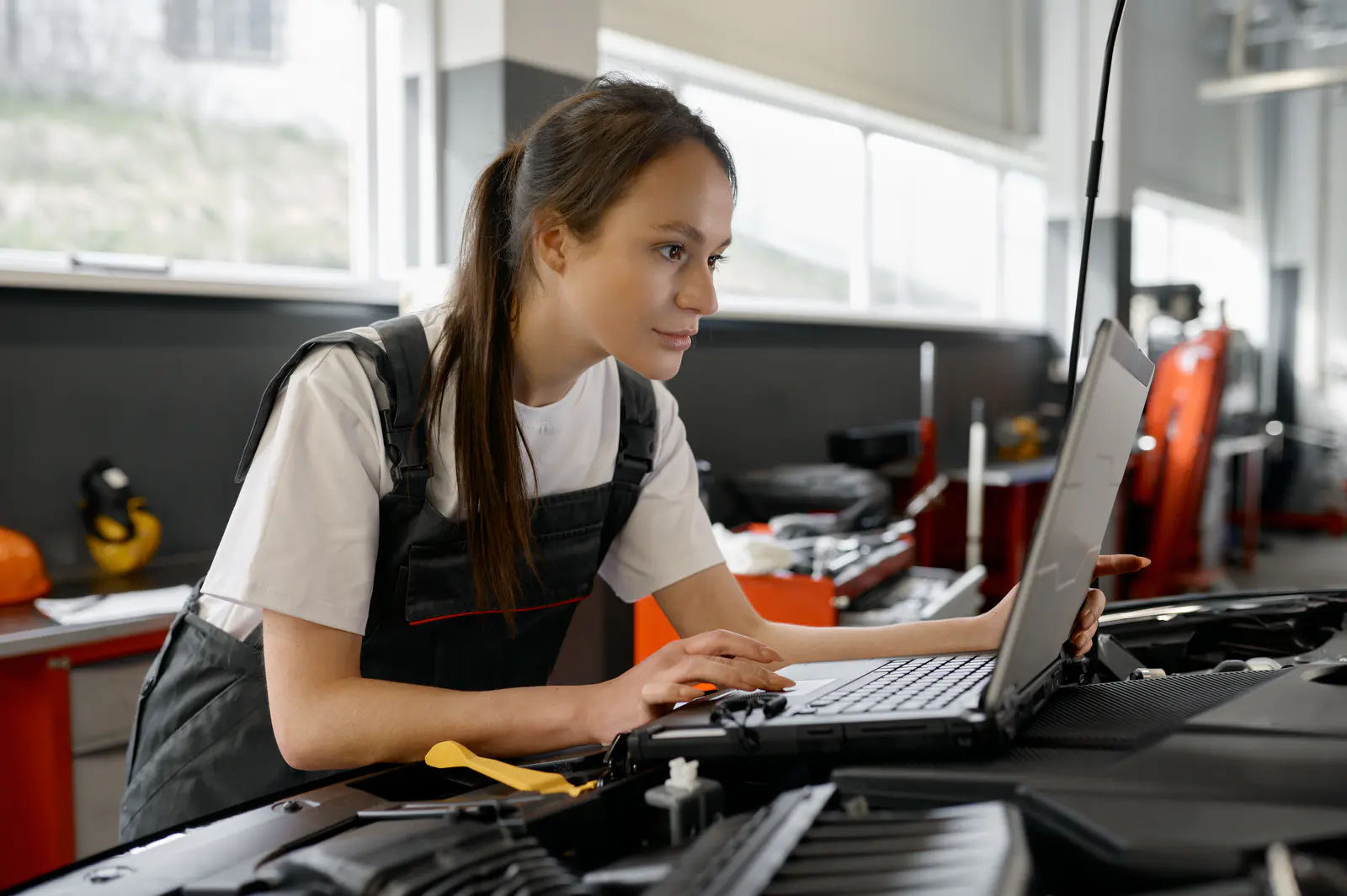 back-view-on-woman-auto-engineer-doing-computer-di-2026-01-06-09-12-46-utc